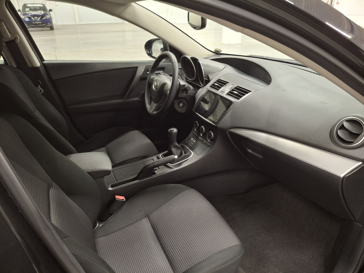 Mazda 3 с пробегом — 2013 год. Фото: #10