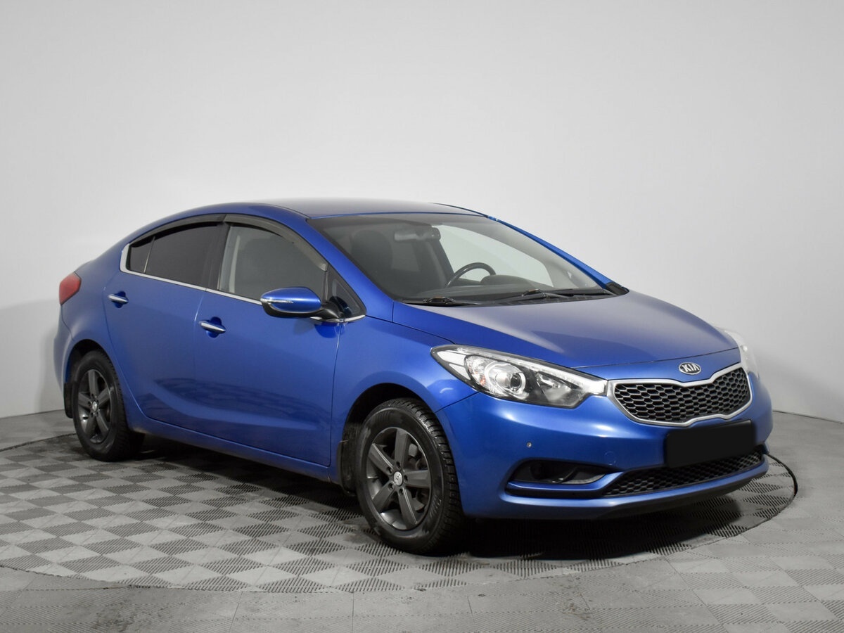 Kia Cerato с пробегом — 2014 год. Фото: #2