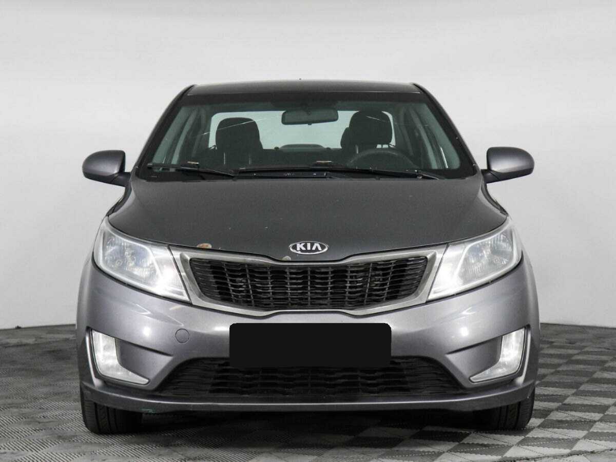 Kia Rio с пробегом — 2013 год. Фото: #1