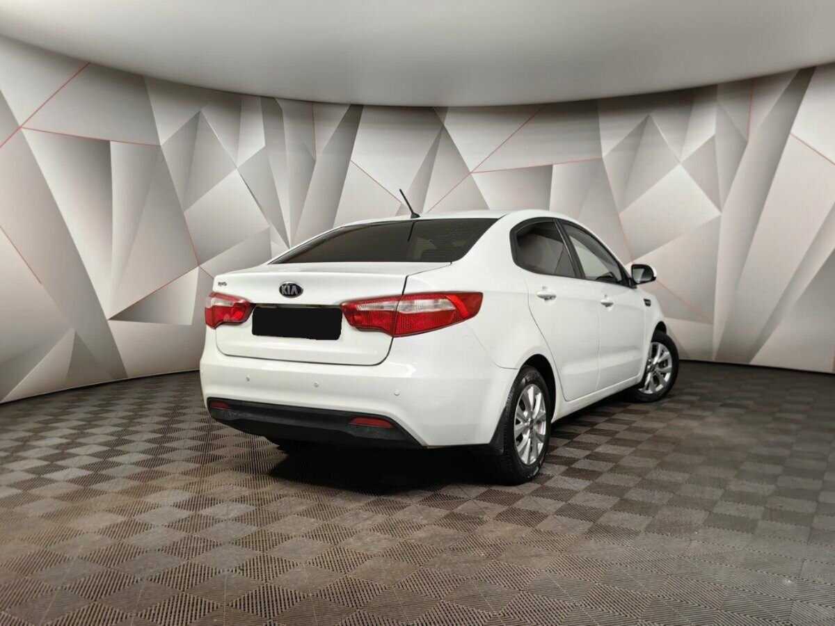 Kia Rio с пробегом — 2013 год. Фото: #1